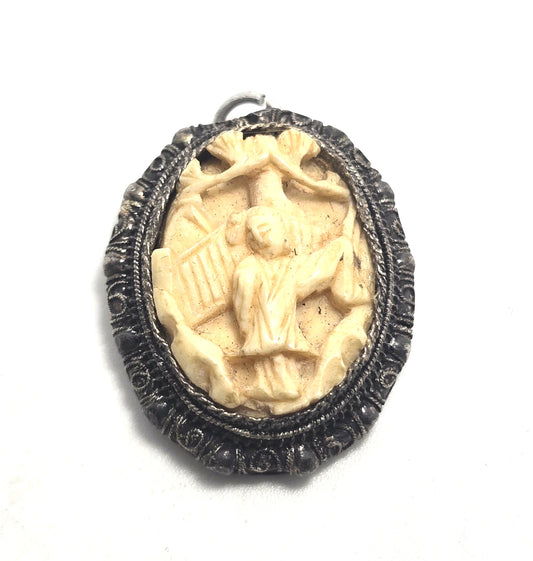 Carved Chinese Export antique sterling silver filigree geisha pendant.