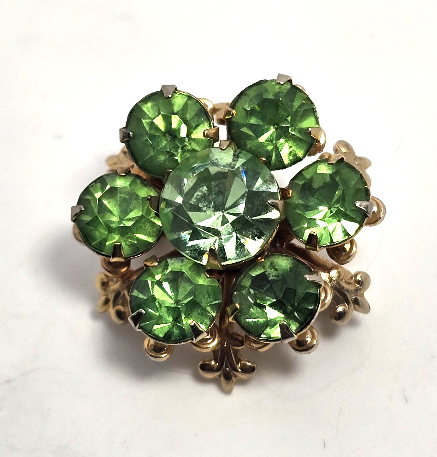 Green uranium glass rhinestone gold toned small flower UV glow vintage brooch