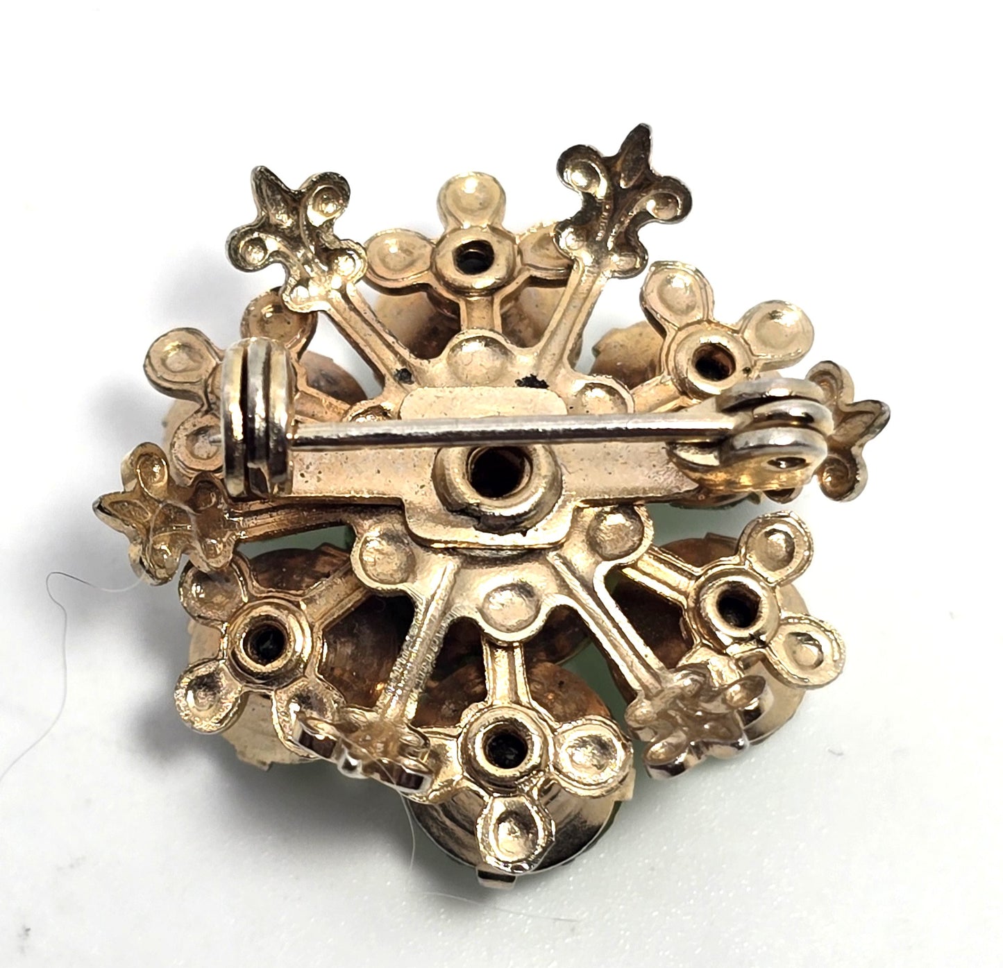 Green uranium glass rhinestone gold toned small flower UV glow vintage brooch