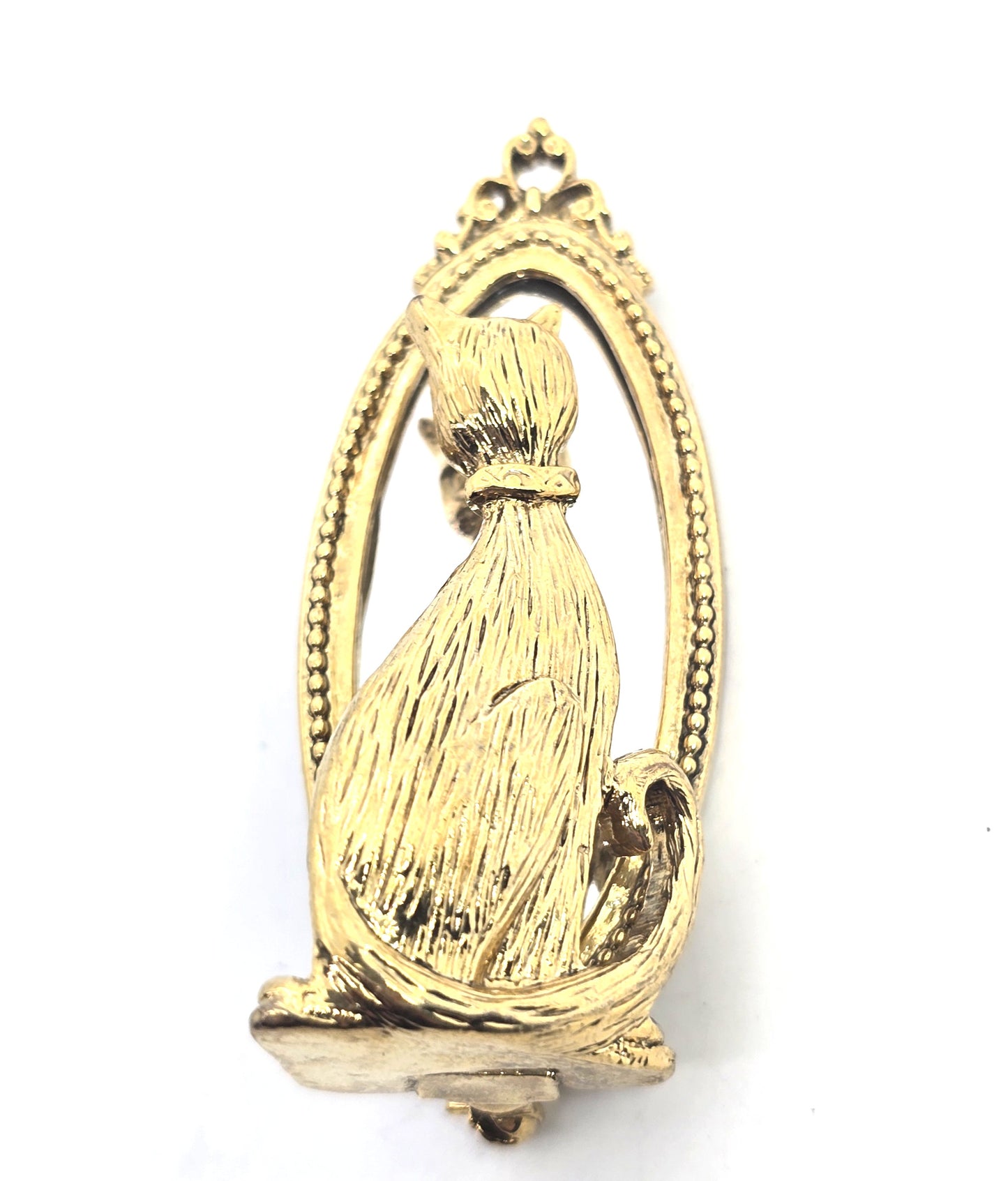 Cat looking in mirror gold toned detailed vintage cat brooch