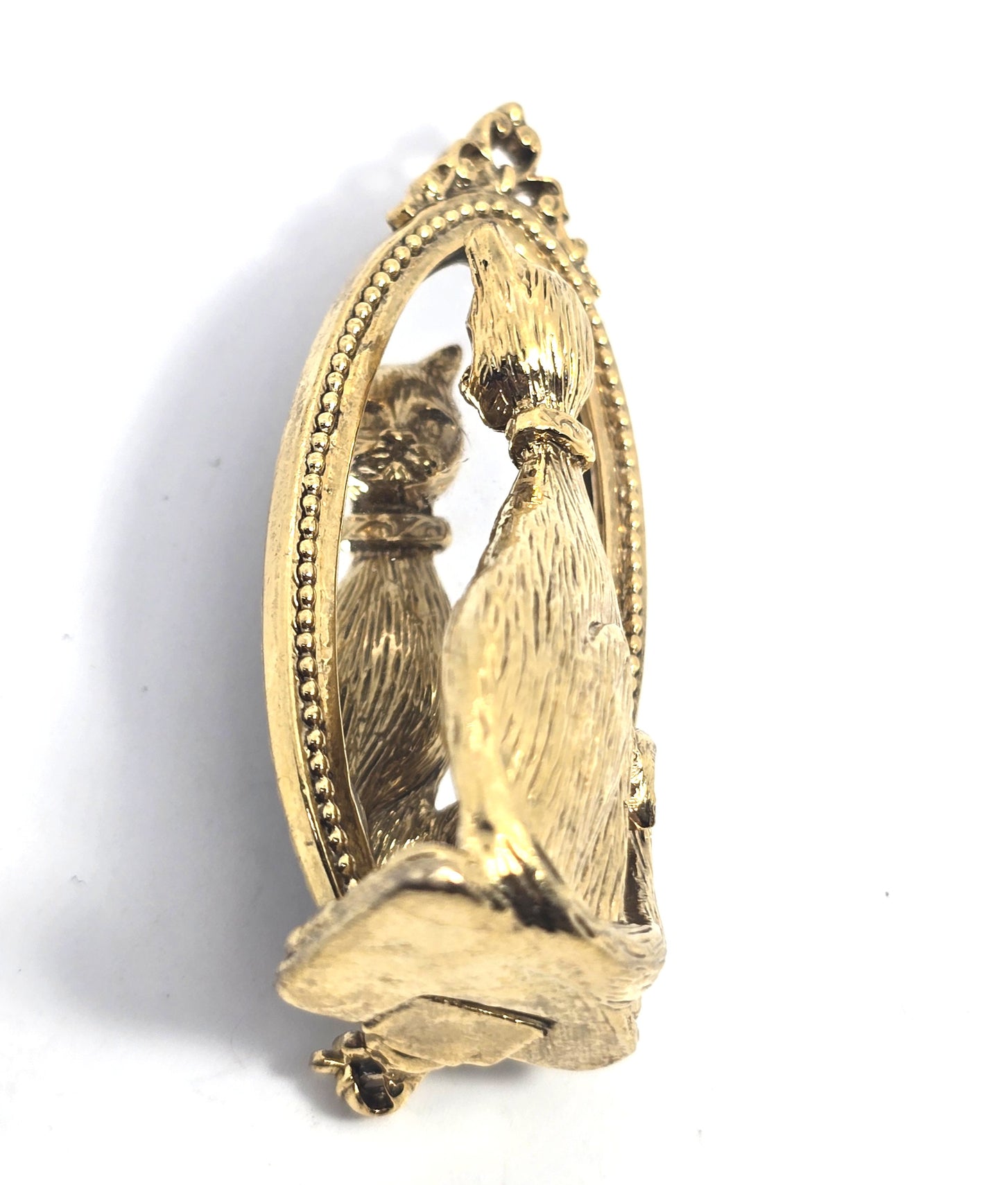 Cat looking in mirror gold toned detailed vintage cat brooch
