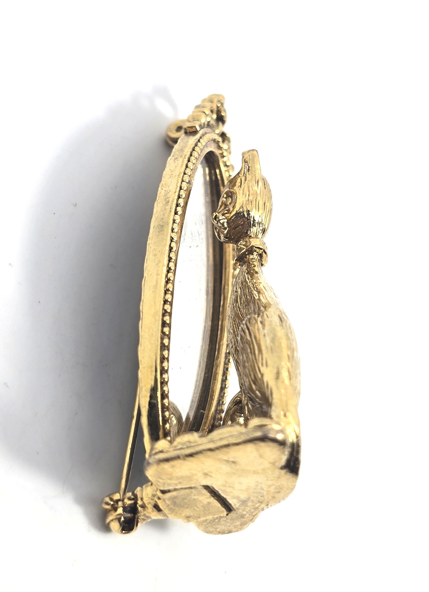 Cat looking in mirror gold toned detailed vintage cat brooch