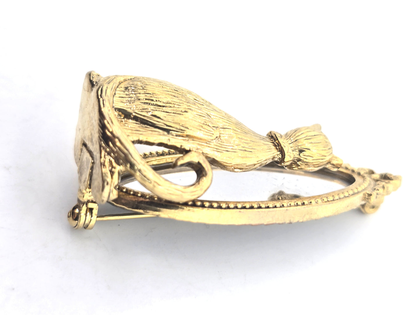 Cat looking in mirror gold toned detailed vintage cat brooch