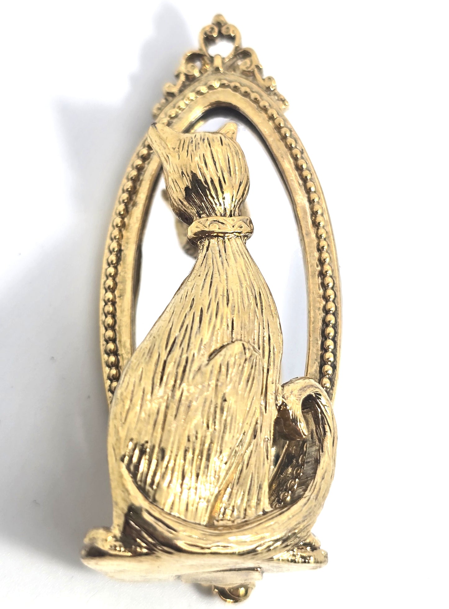 Cat looking in mirror gold toned detailed vintage cat brooch