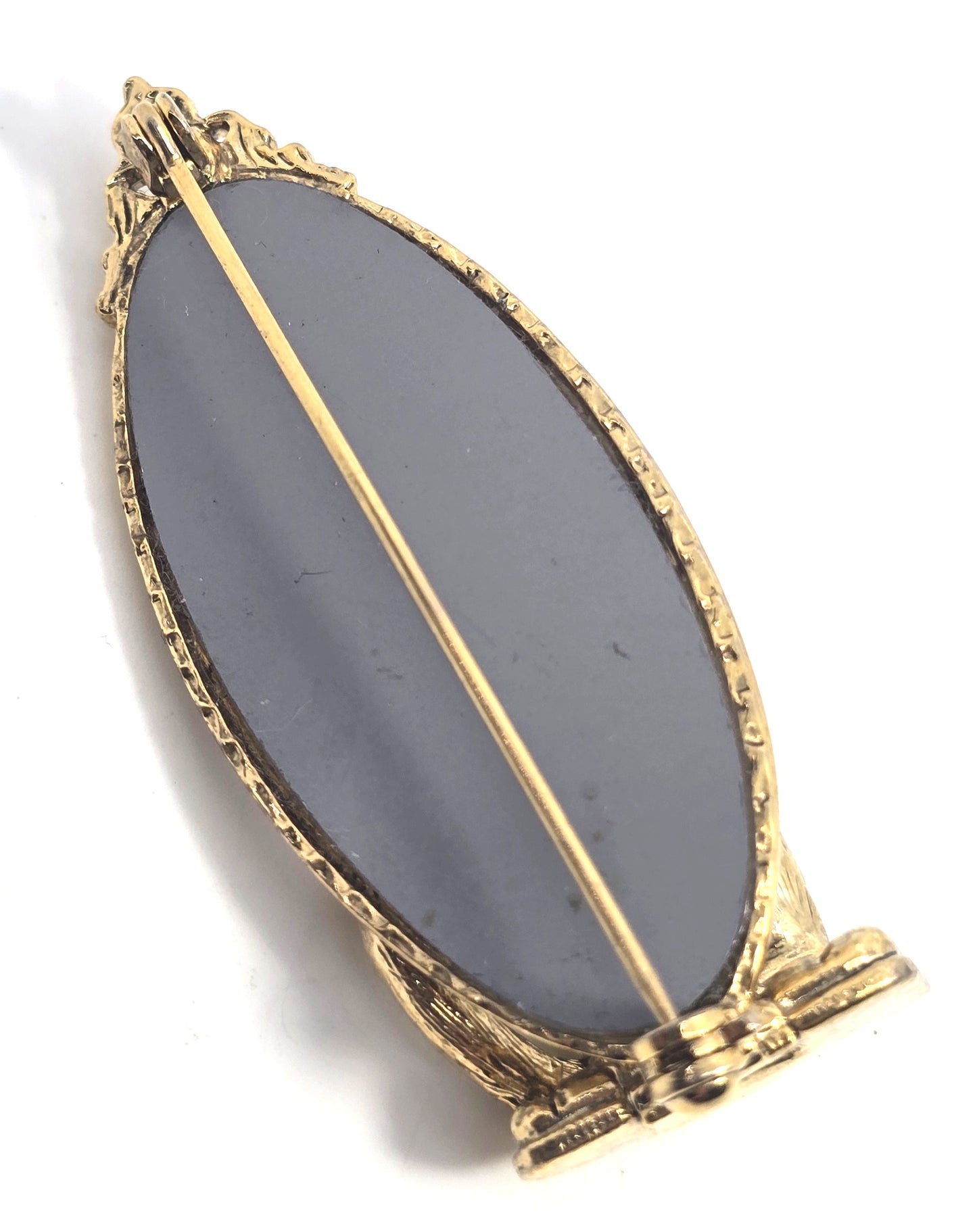 Cat looking in mirror gold toned detailed vintage cat brooch