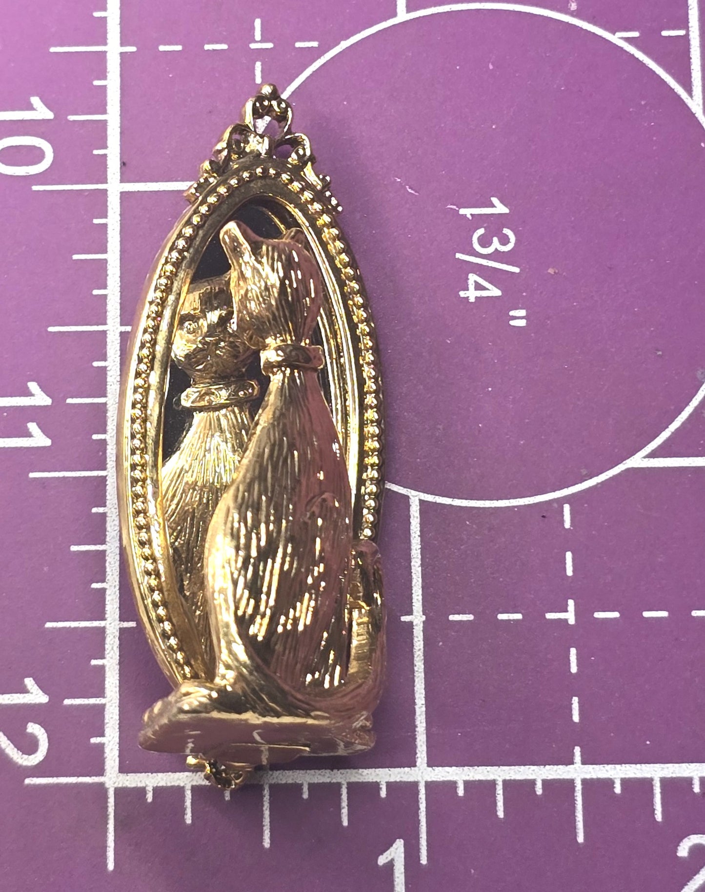 Cat looking in mirror gold toned detailed vintage cat brooch