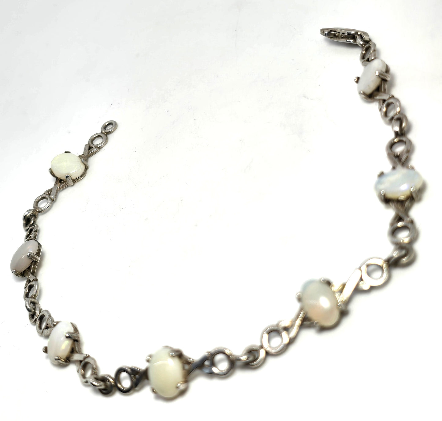 White opal 7 stone X and O sterling silver vintage tennis bracelet
