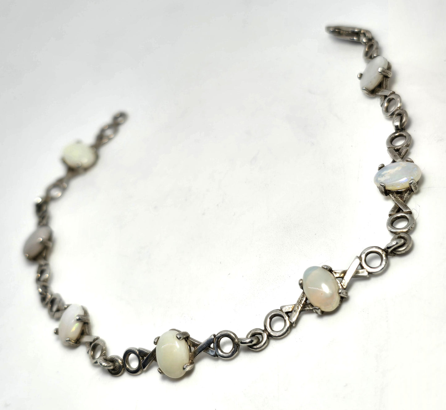 White opal 7 stone X and O sterling silver vintage tennis bracelet