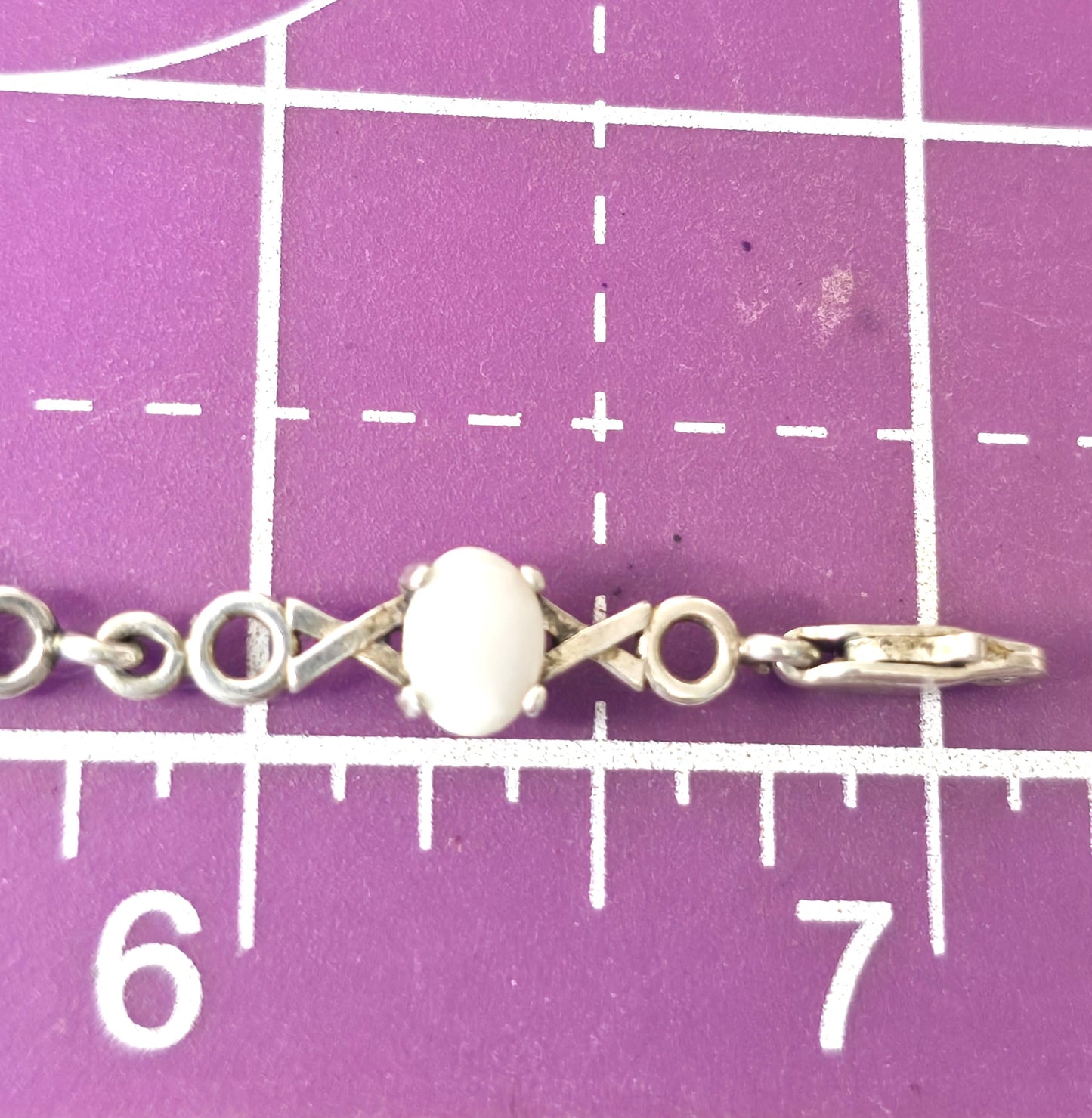 White opal 7 stone X and O sterling silver vintage tennis bracelet