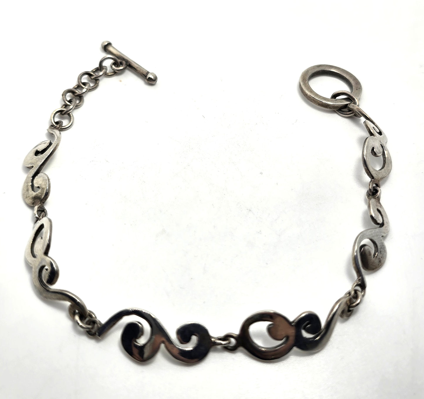 Barse Filigree swirl linked panel signed toggle tennis bracelet