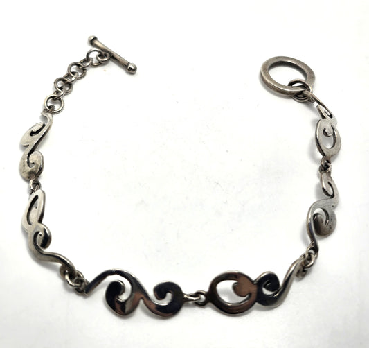 Barse Filigree swirl linked panel signed toggle tennis bracelet