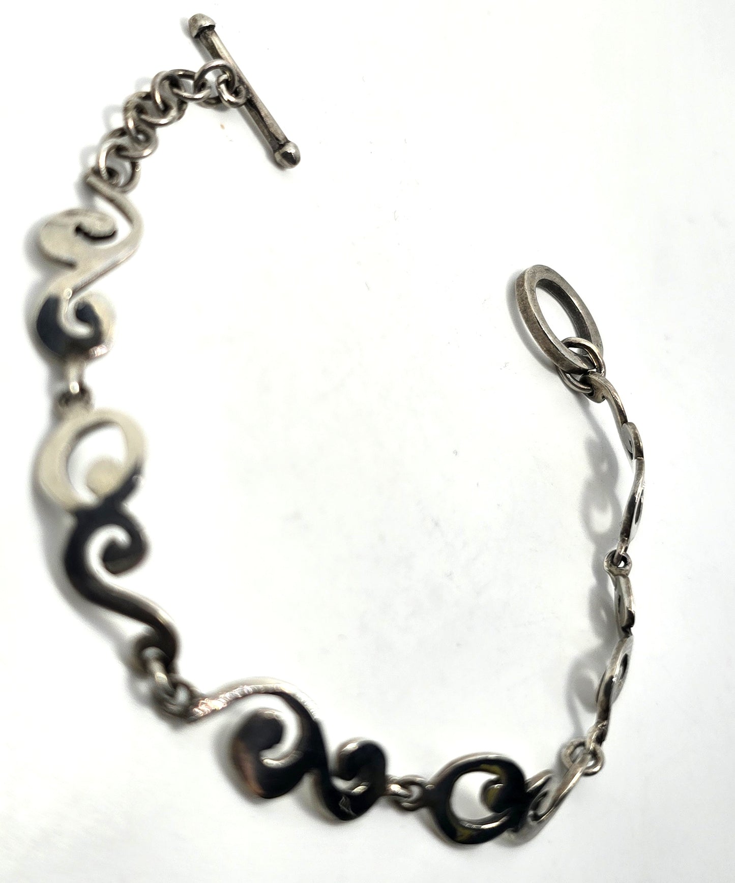 Barse Filigree swirl linked panel signed toggle tennis bracelet