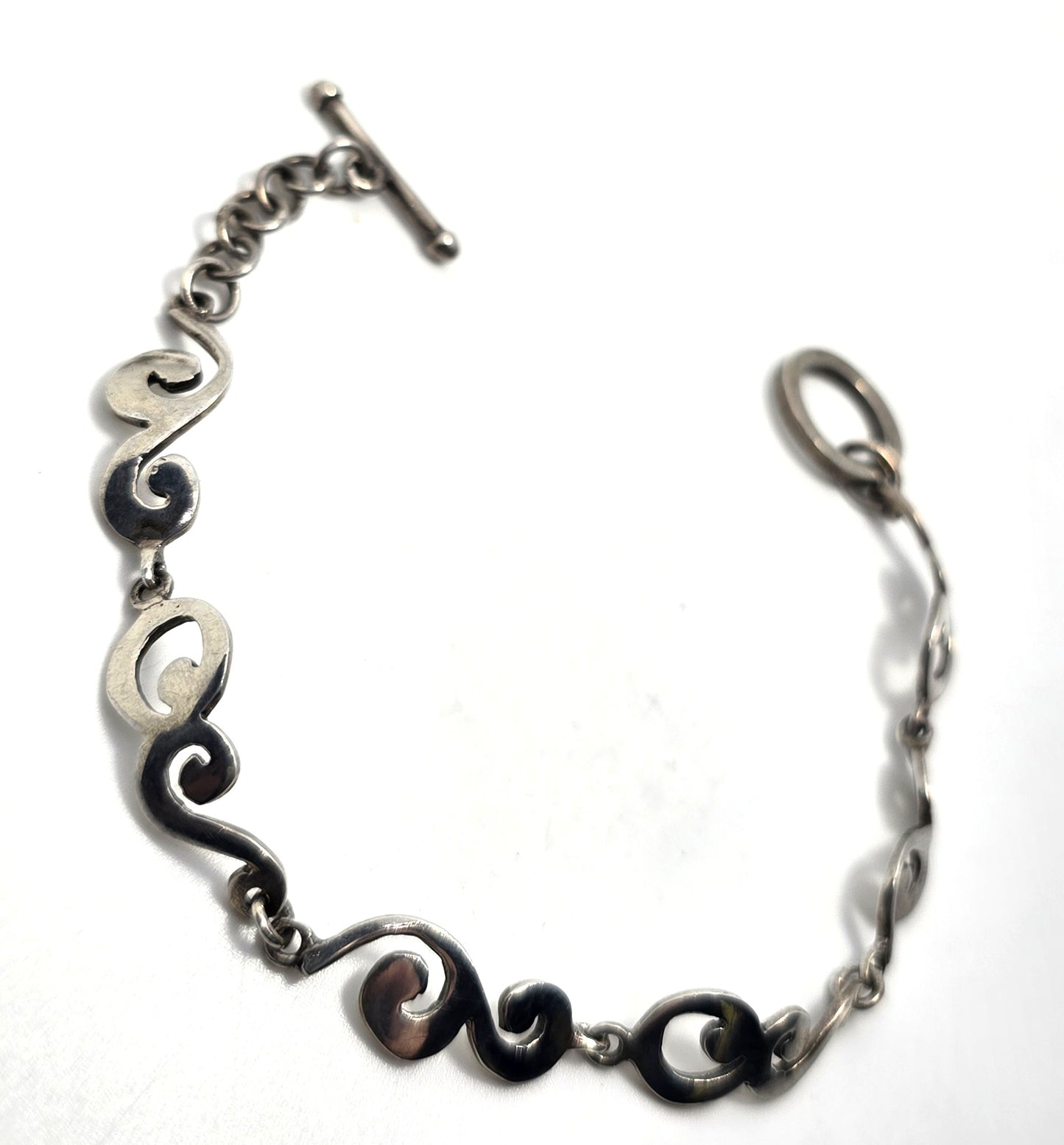 Barse Filigree swirl linked panel signed toggle tennis bracelet