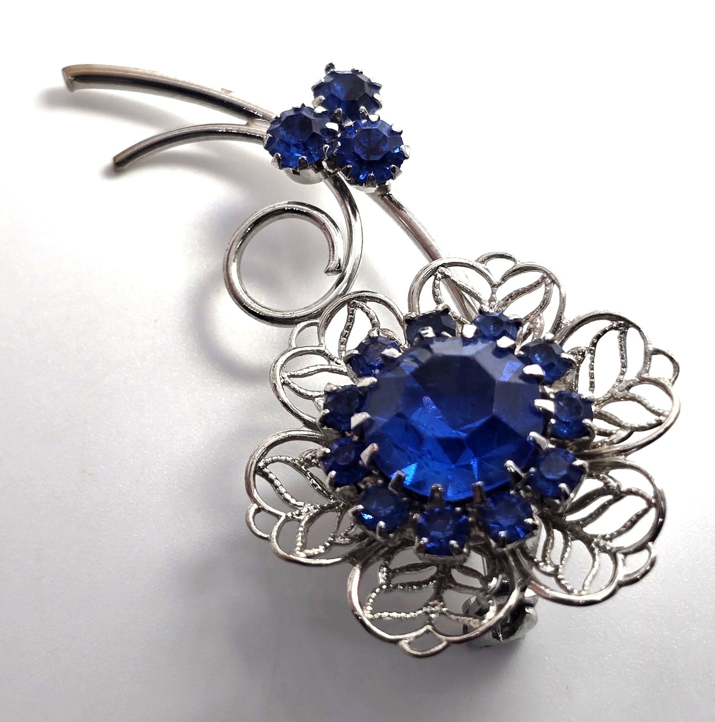 Bright blue rhinestone flower mid century MCM vintage spray brooch