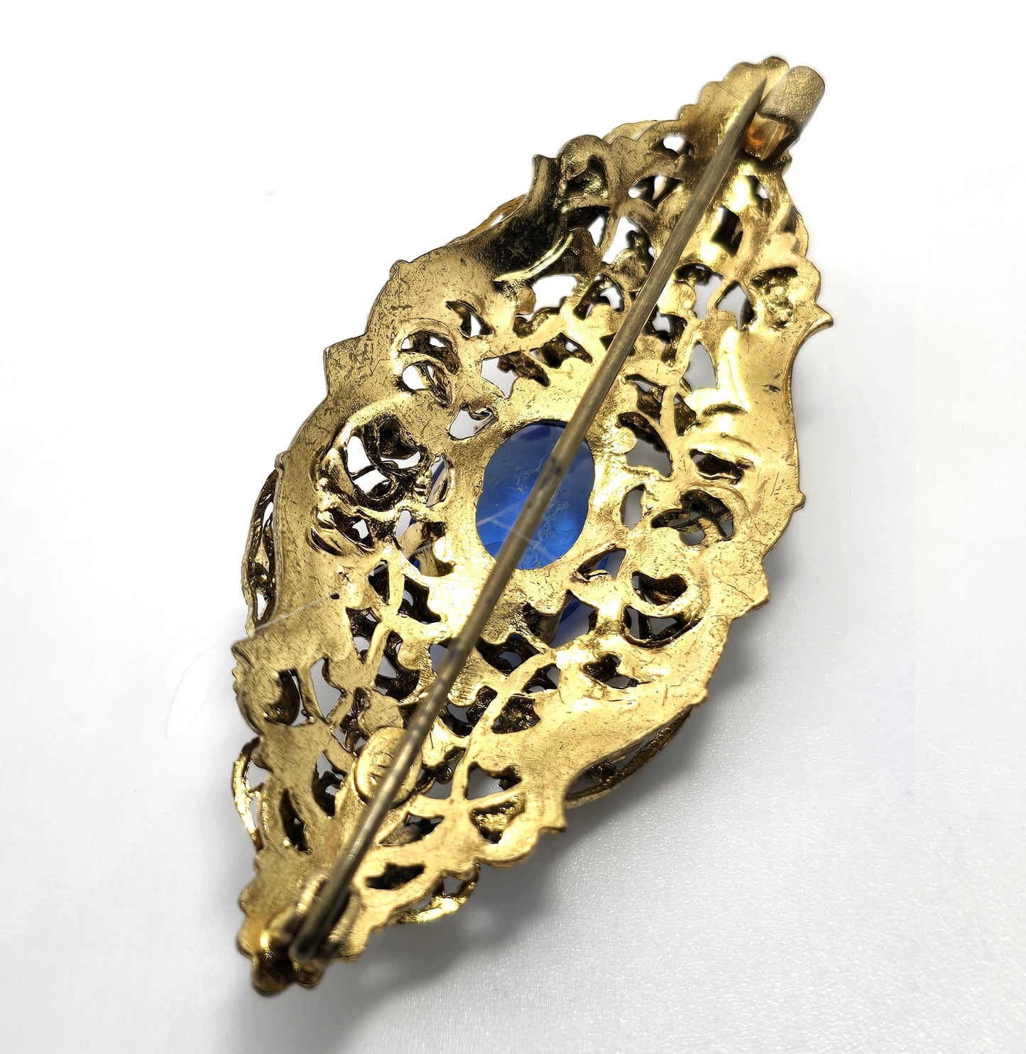 Czech bright blue paste glass rhinestone vintage gold toned filigree brooch