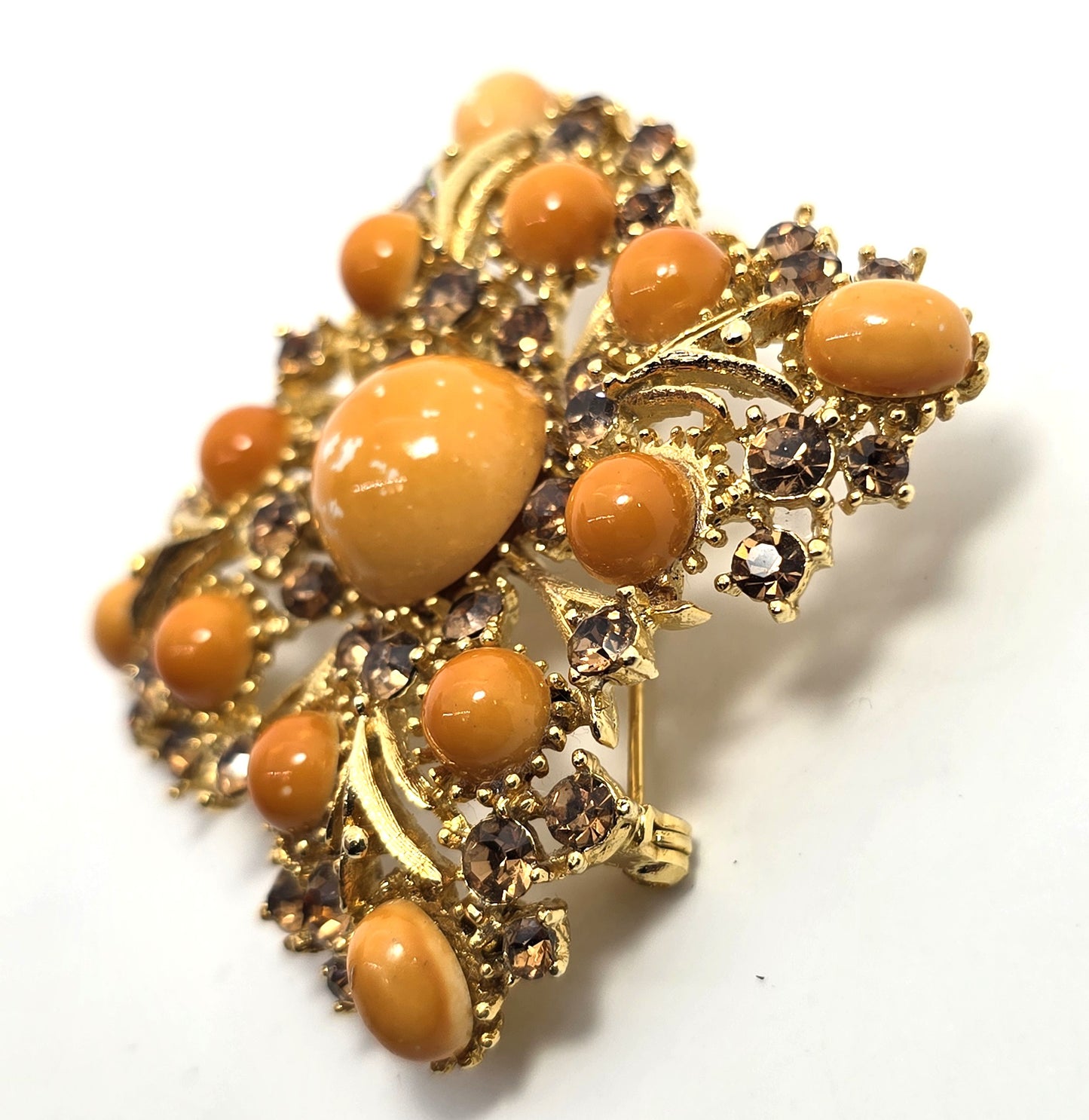 Weiss orange domed cabochon vintage gold toned rhinestone brooch