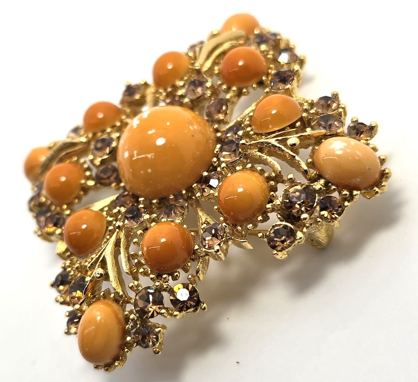 Weiss orange domed cabochon vintage gold toned rhinestone brooch