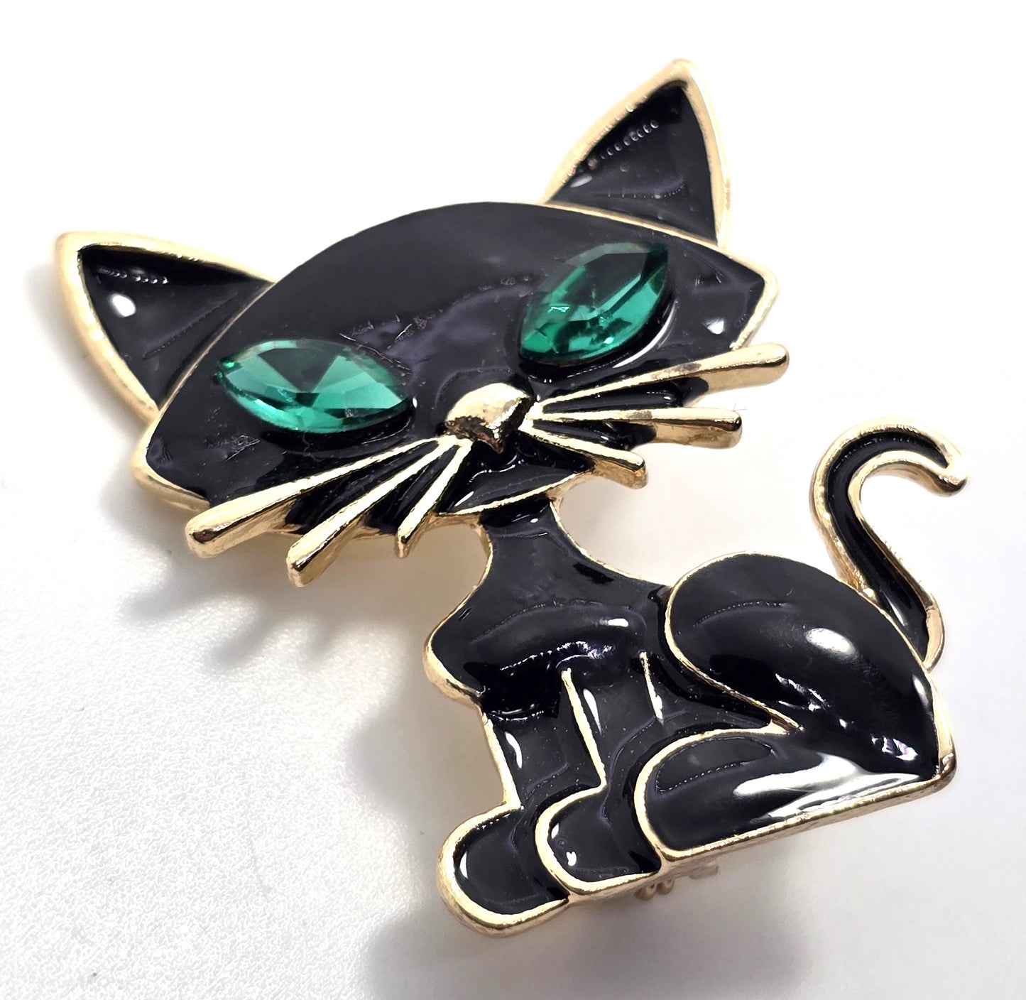 Black enamel retro sassy kitty cat green rhinestone eyes vintage brooch