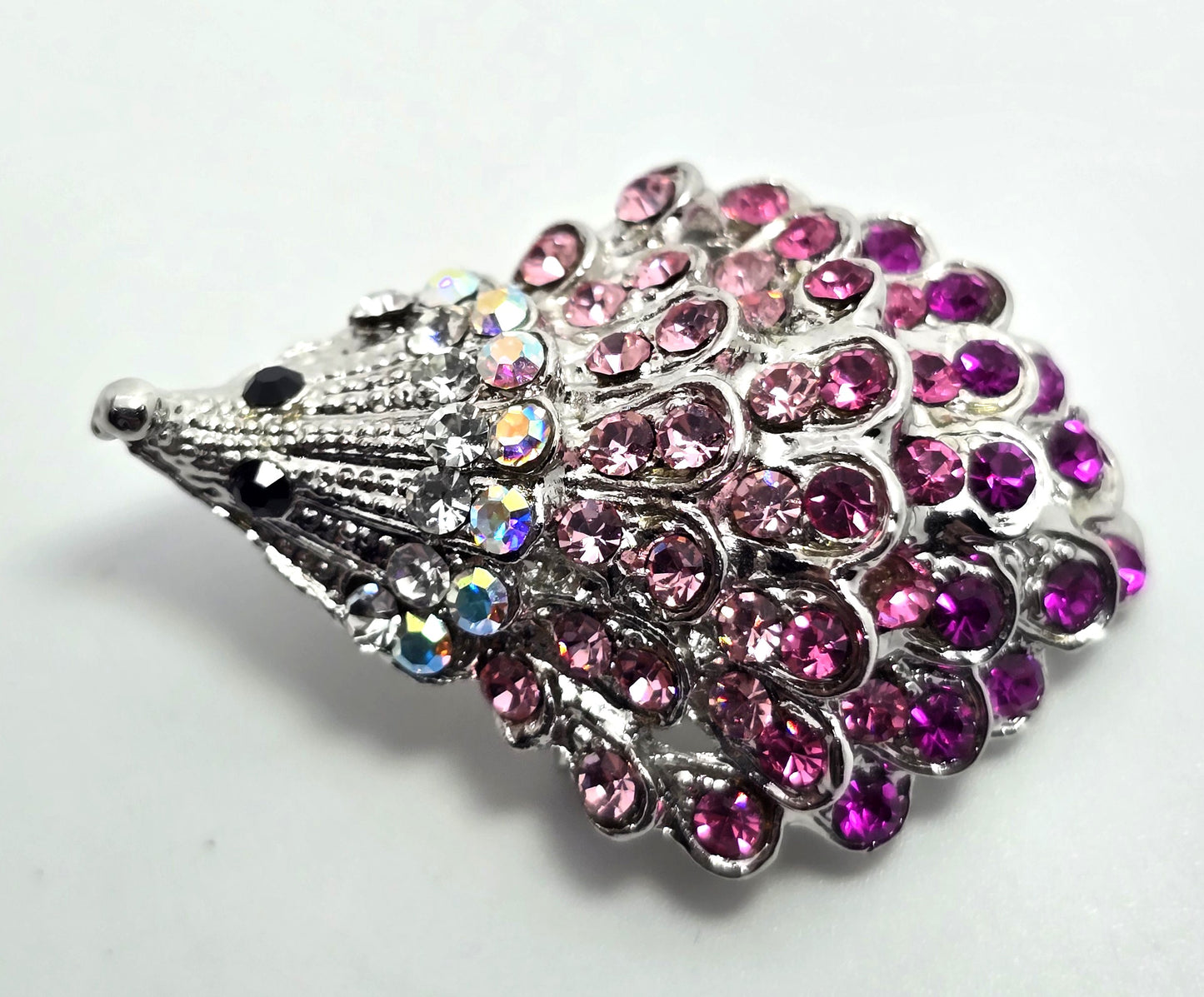 SL Pink rhinestone curious hedgehog figural silver toned brooch