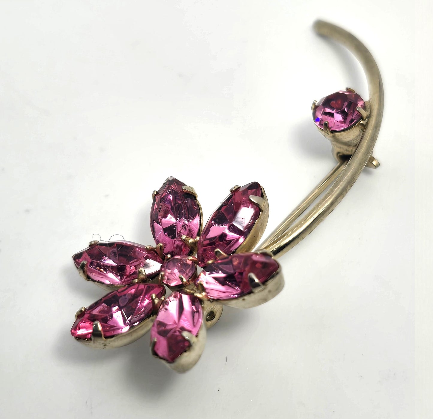 Pink rhinestone flower petal gold toned mid century vintage spray brooch