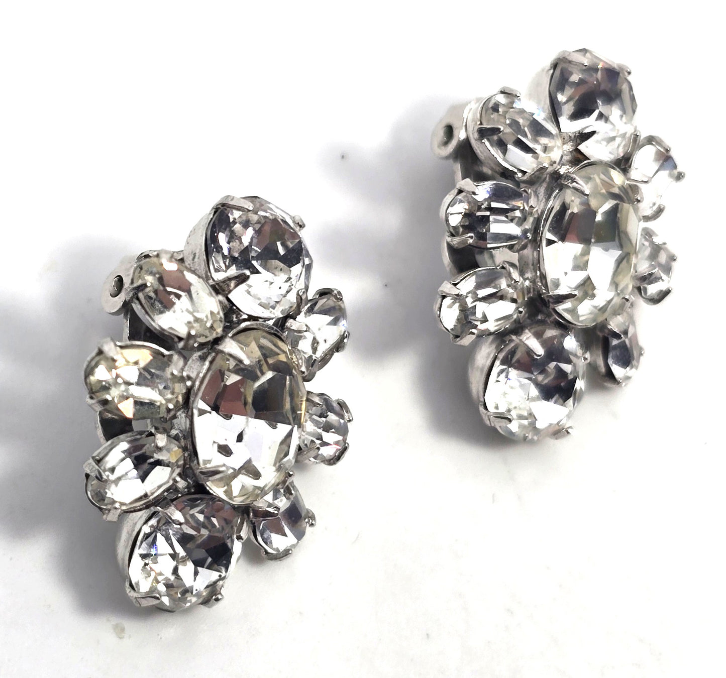 Bright vintage clear rhinestone silver toned cluster clip on earrings mid century