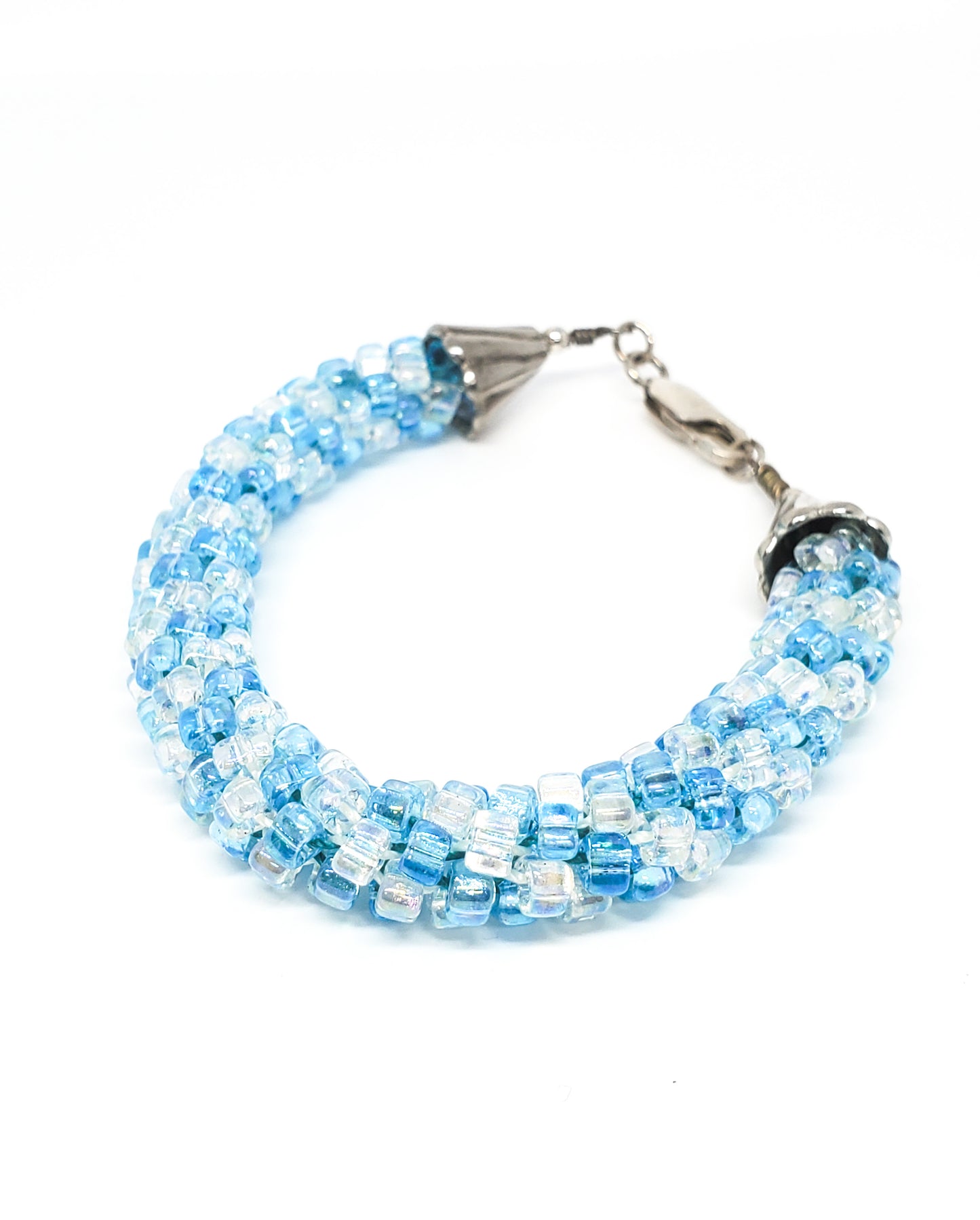 Oceans baby blue and clear torsade beaded bracelet with sterling silver clasp