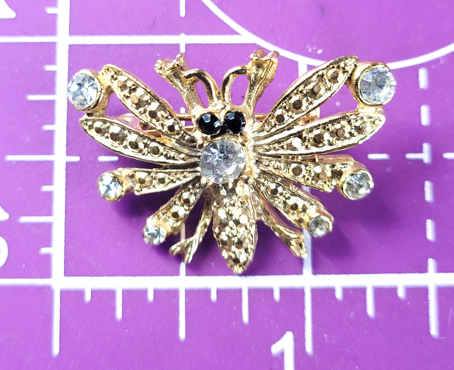 Bee gold toned vintage black and white rhinestone insect figural brooch