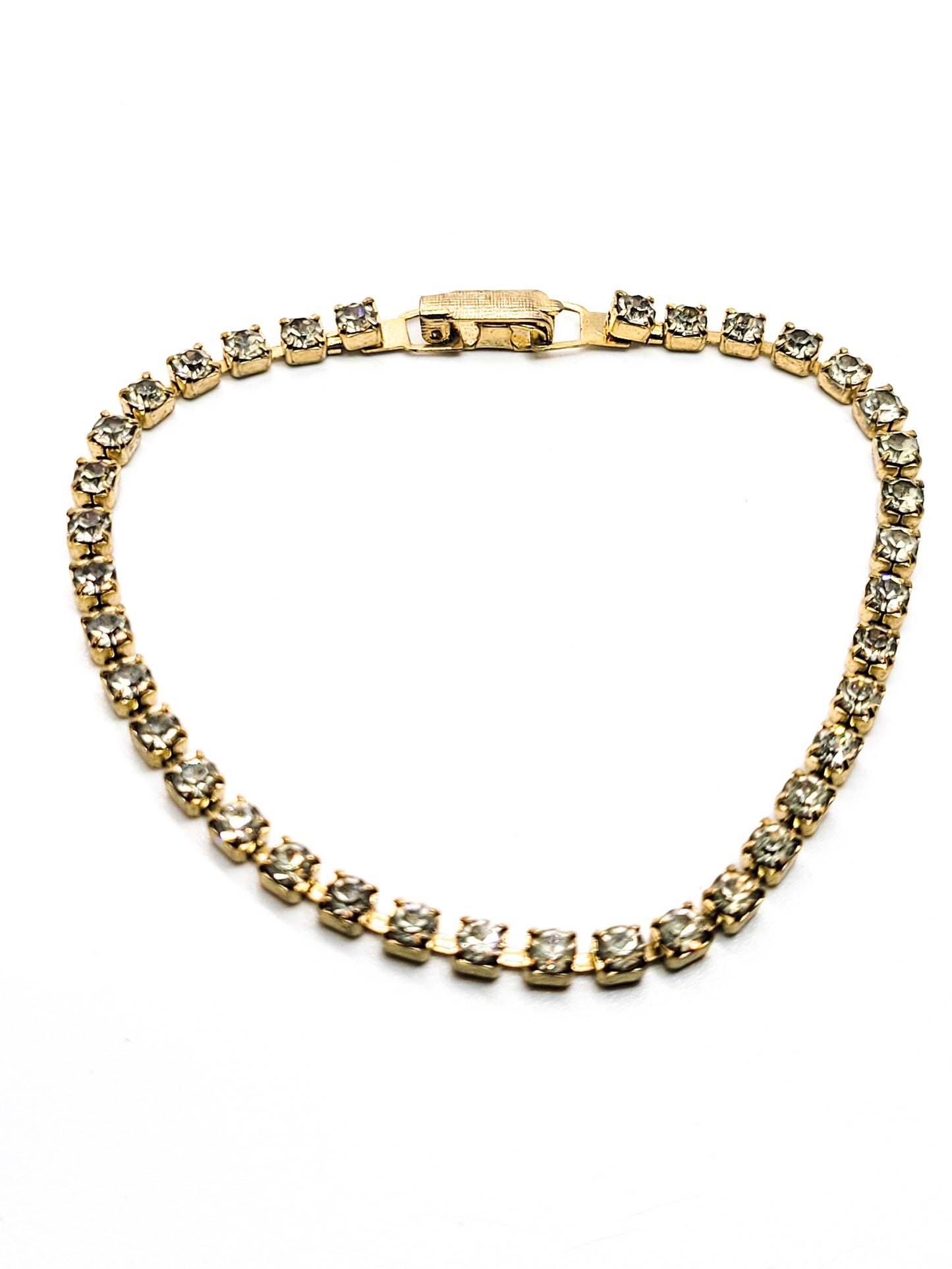 Single row simple clear gold toned vintage rhinestone tennis bracelet