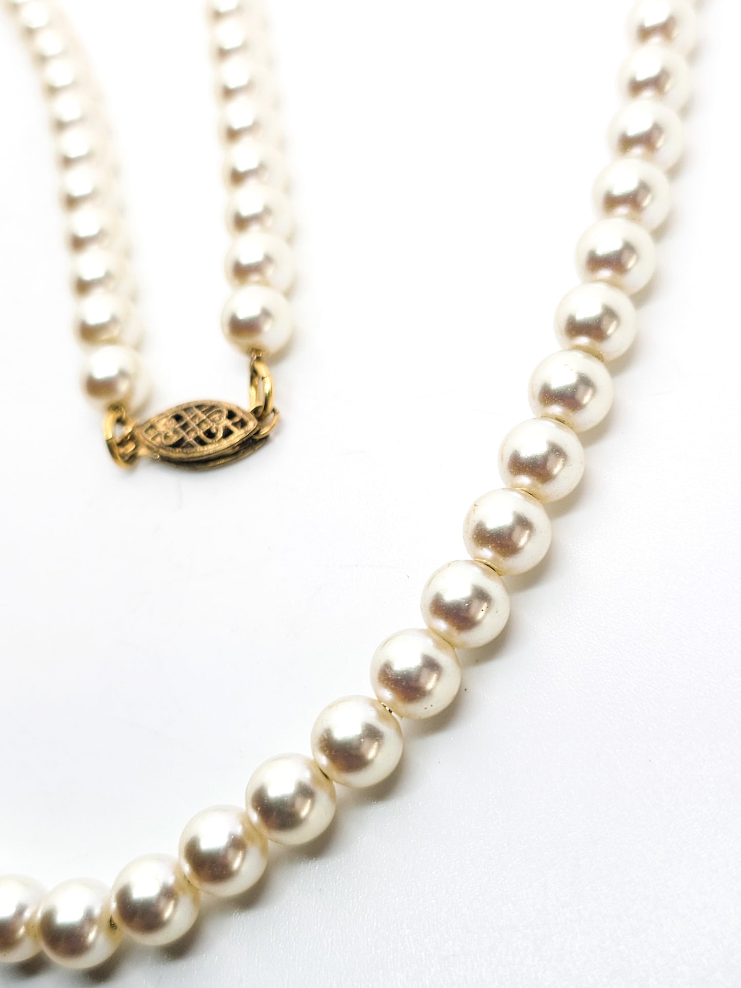 White 6mm faux pearl vintage necklace with sterling silver clasp mounted on chain