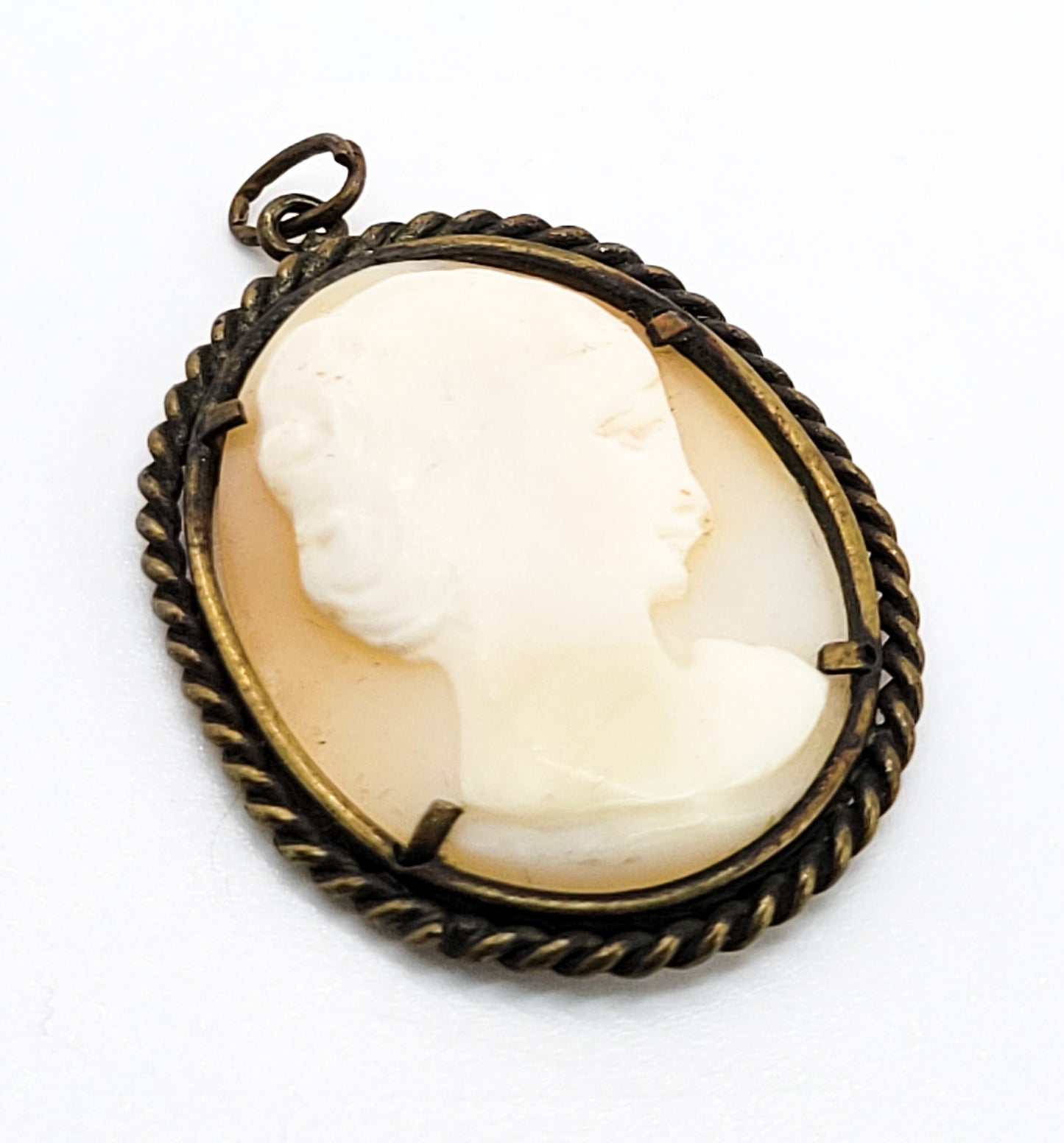 Carved shell right facing vintage woman cameo pendant in twisted rope brass setting