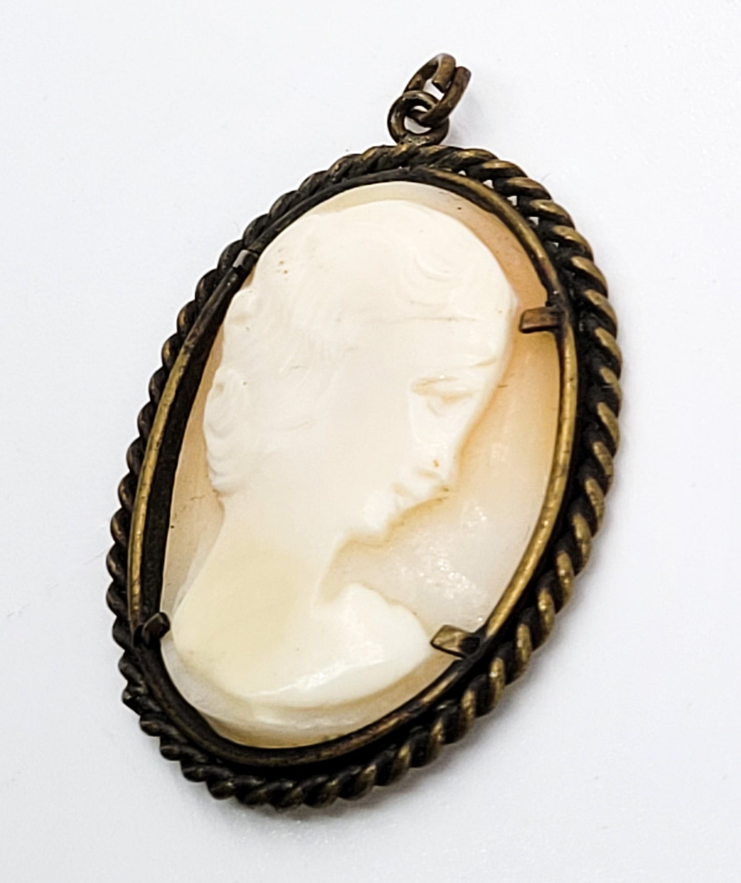 Carved shell right facing vintage woman cameo pendant in twisted rope brass setting