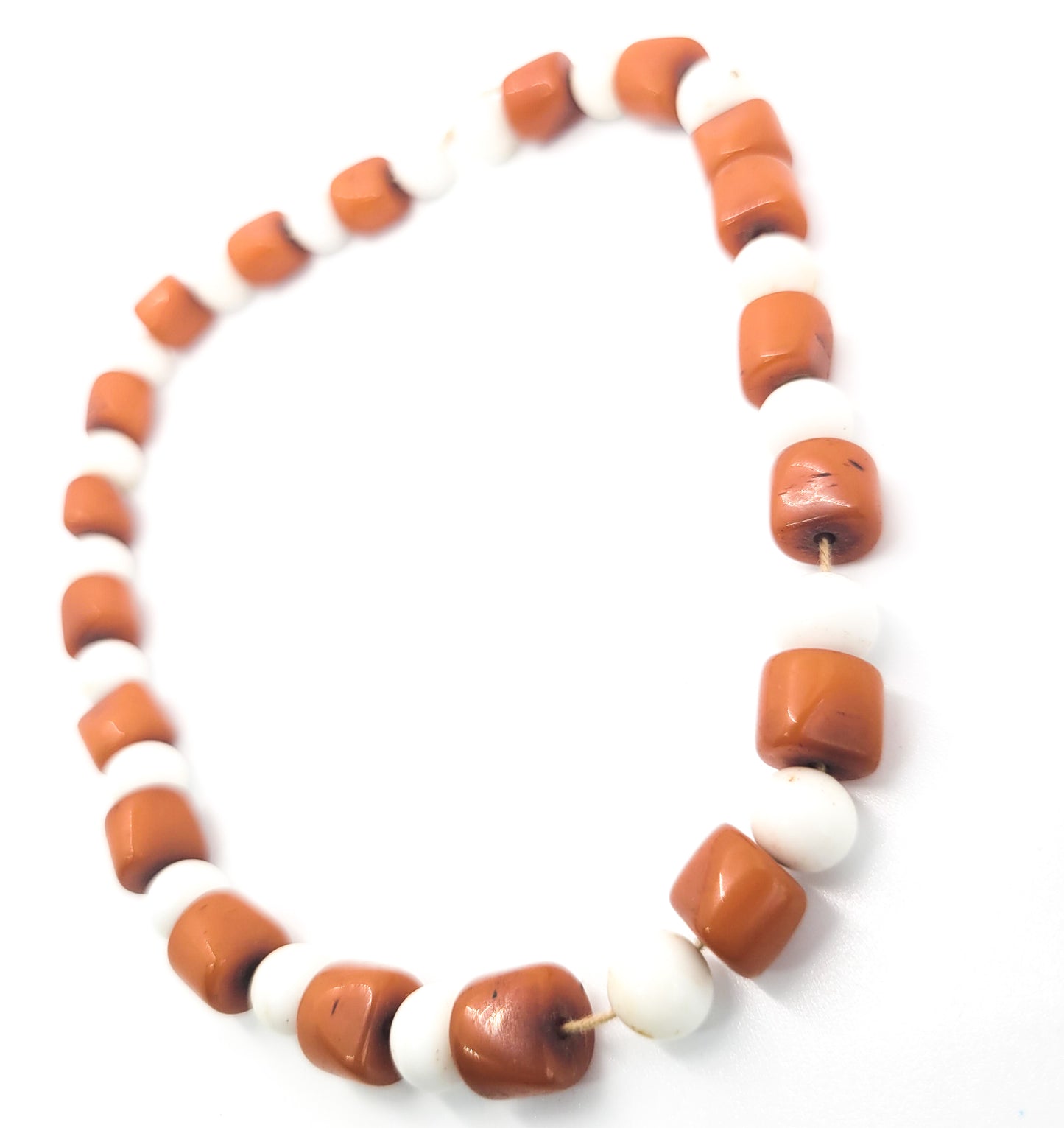 Amber bakelite and white milk glass strand of vintage beads on silk