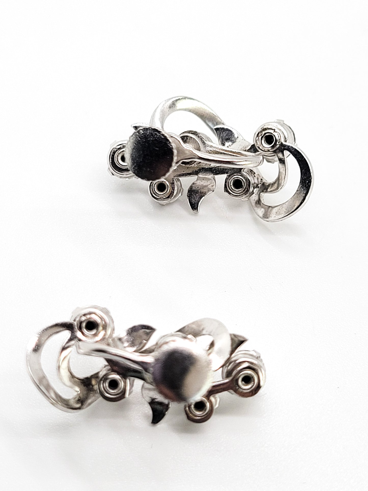 Clear rhinestone atomic swirl vintage clear mid century silver screw back earrings