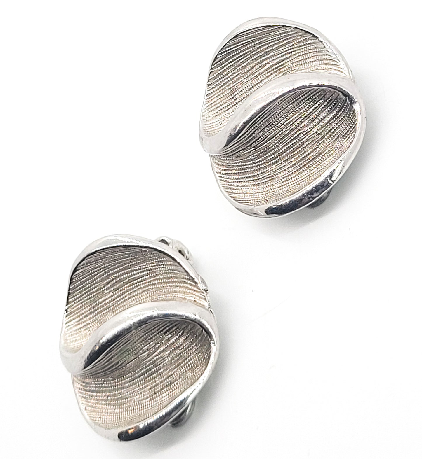 Kramer brushed silver toned swirled modernist vintage clip on earrings